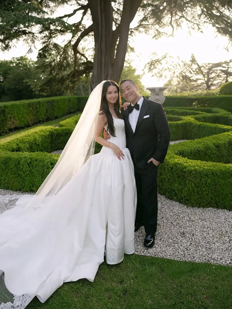 A couple in a hedge maze garden
